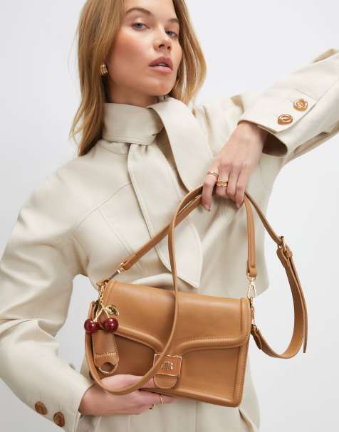 River Island Tab front cherry charm shoulder bag in beige - view 1