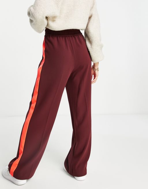 Pants with red store stripe down side