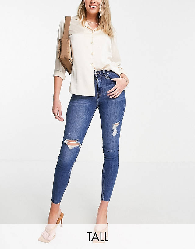 River Island Tall - ripped raw hem high rise skinny jeans in mid auth blue