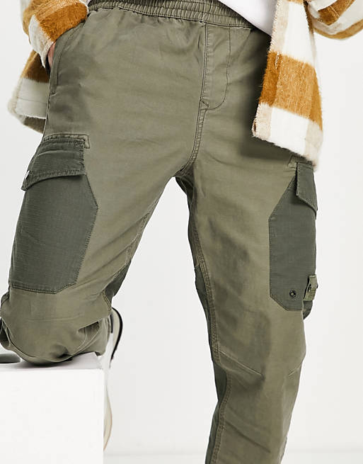 Men River Island tapered blocked cargo trousers in washed khaki 