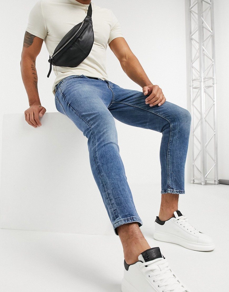 River Island tapered jeans in mid wash blue-Blues