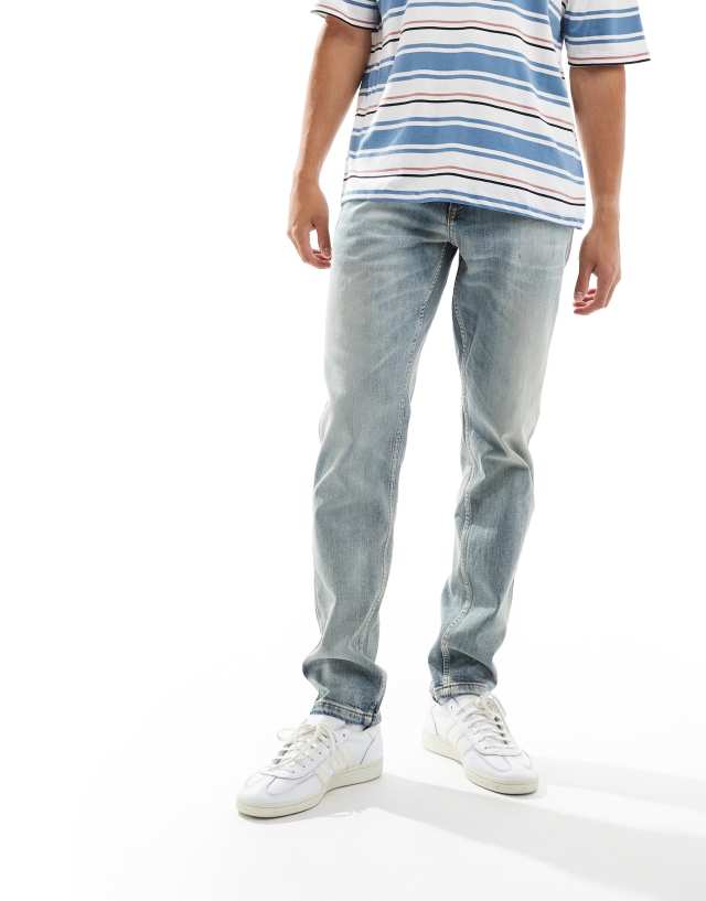 River Island - tapered jeans in midwash blue