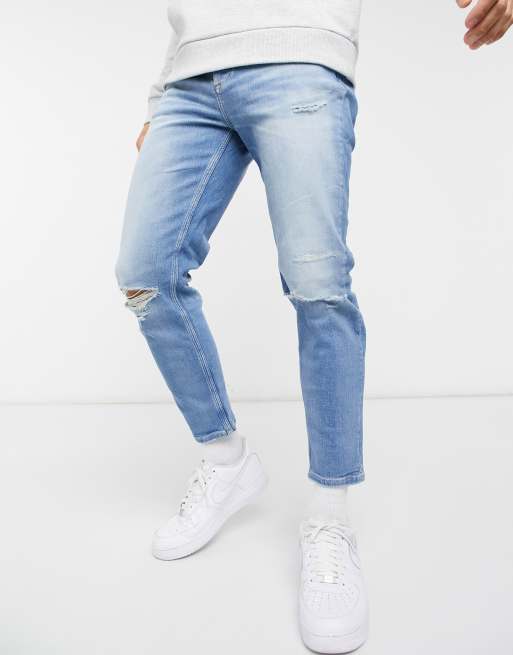 River Island tapered jeans with rips in light blue | ASOS