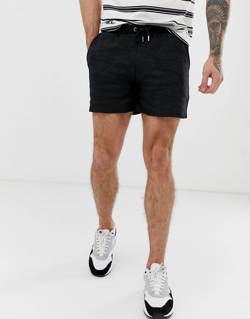 River Island textured shorts in black camo | ASOS
