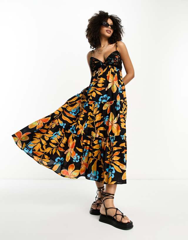 River Island - tiered maxi beach dress in black tropical print