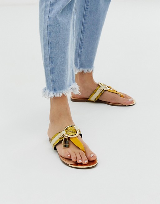 River Island toe post sandals with gold detail in yellow