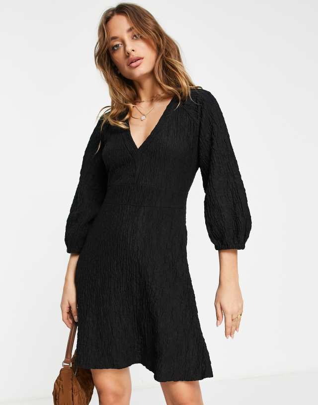 River Island V-neck textured smock mini dress in black