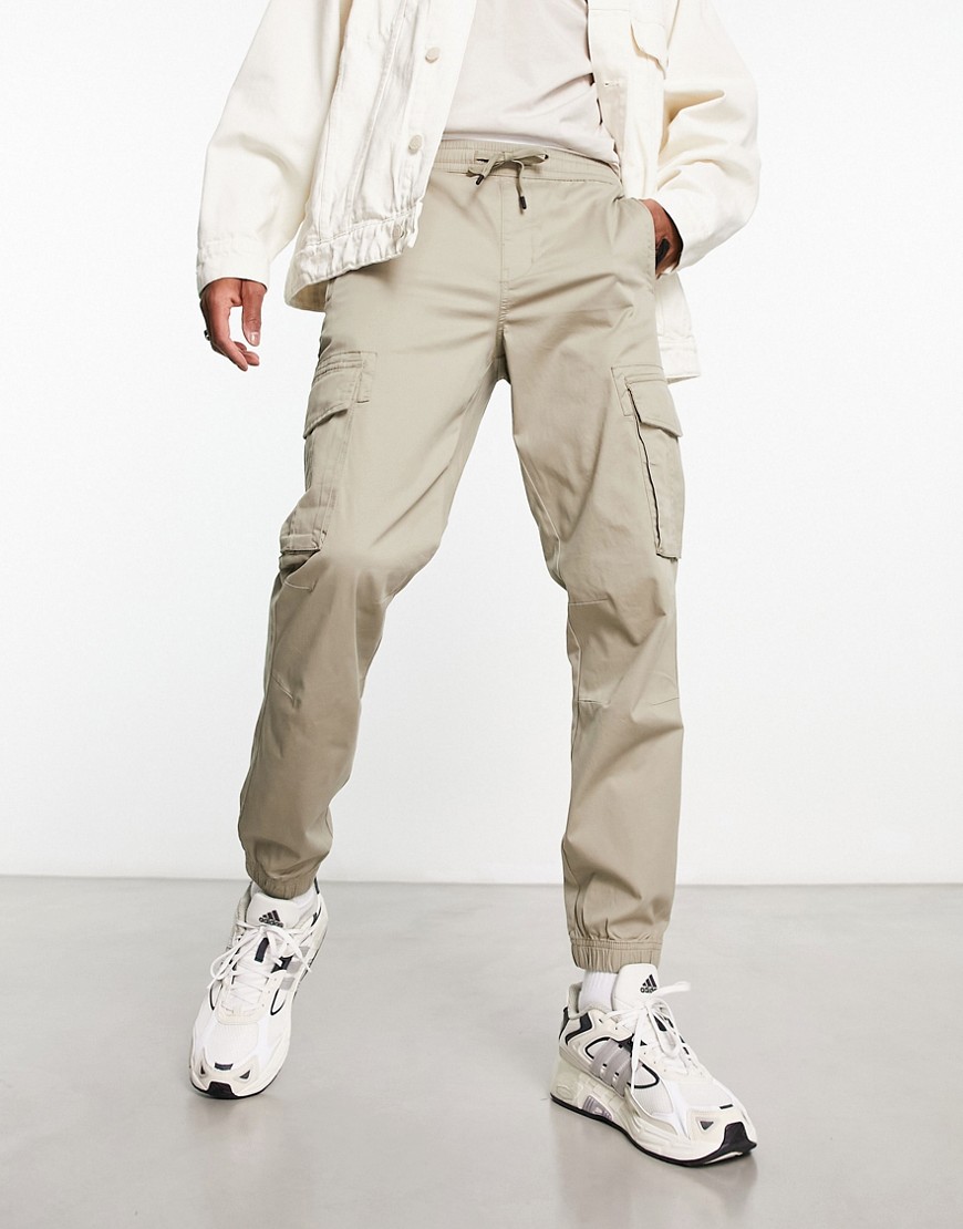 River Island washed look cargo in beige-Neutral