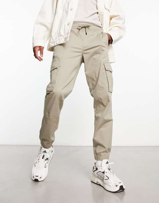 River Island washed look cargo in beige | ASOS