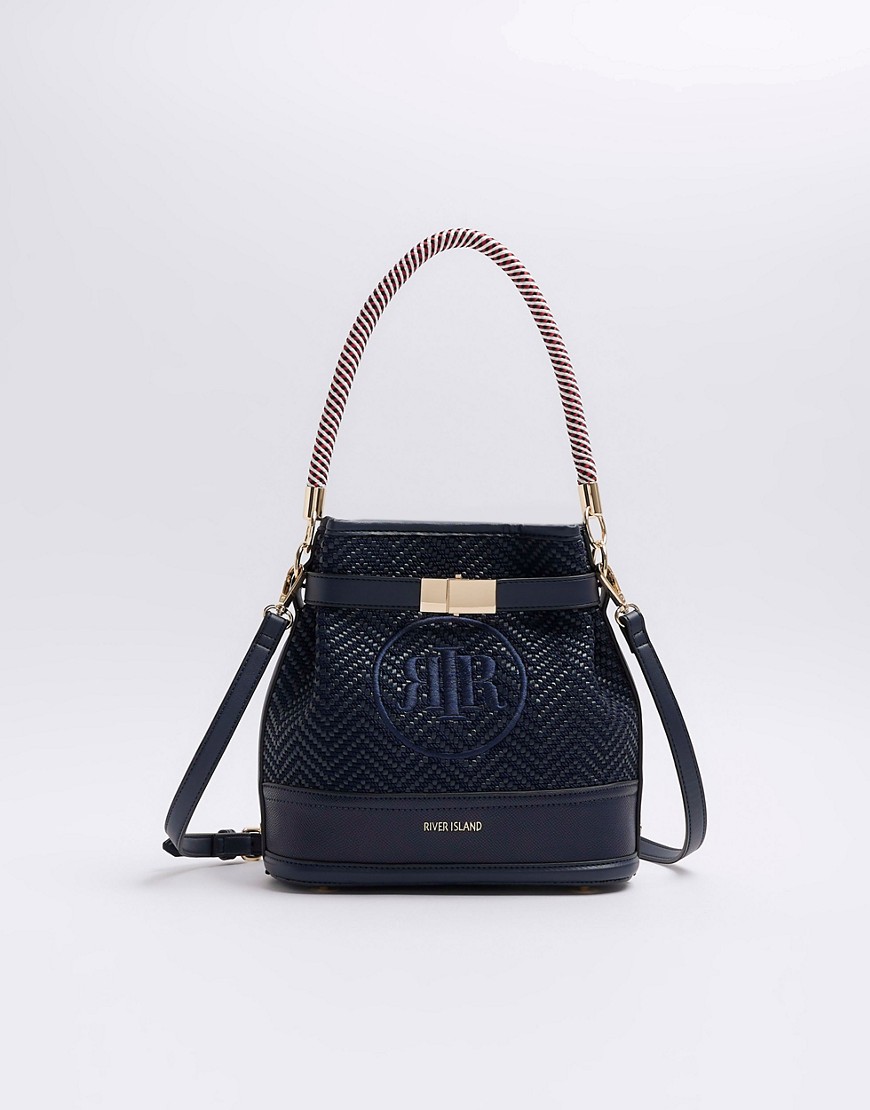 River Island Weave embroidered bucket cross body bag in navy-Blue
