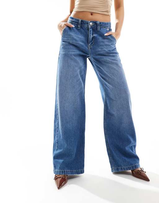 River Island – Weit geschnittene Jeans in verwaschenem Mittelblau