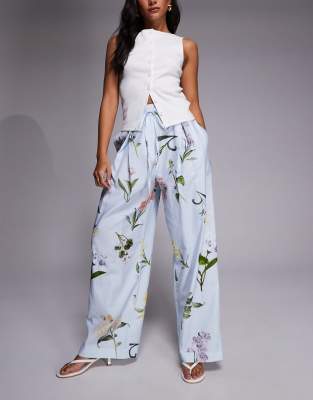 River Island - Weit geschnittene Leinenhose in Hellblau mit Blumenmuster