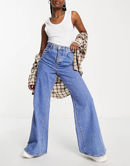 River Island wide leg flared jeans with panel detail in medium blue | ASOS