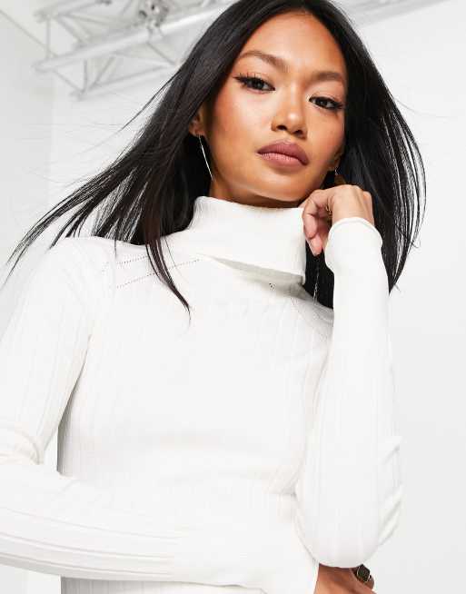 River Island wide rib roll neck jumper in cream | ASOS