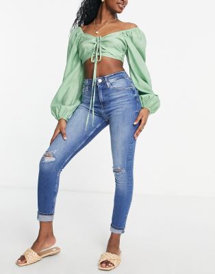 River Island - Zerrissene Jeans in Mittelblau mit engem Schnitt und hohem Bund