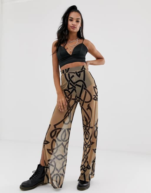 Rokoko - Mesh broek met wijde pijpen, split aan de zijkant en tribal-print