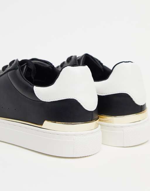 Black sneakers on sale with gold trim