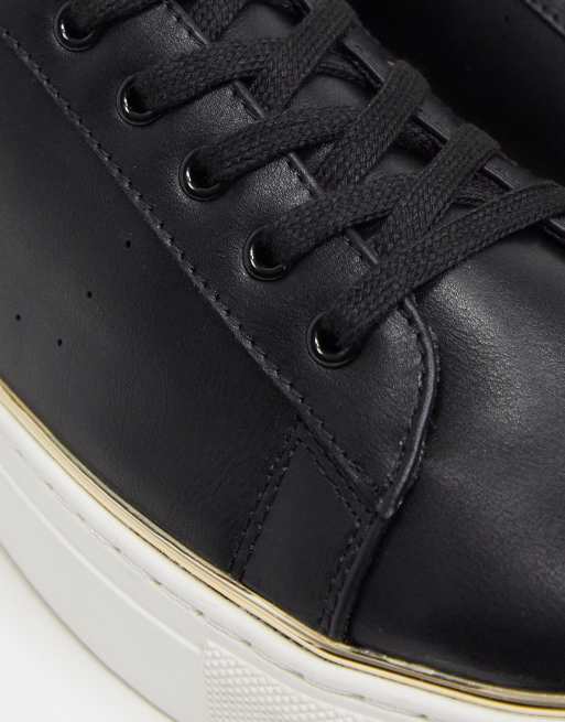 Black sneakers hotsell with gold trim