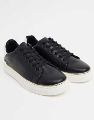 white trainers with gold trim