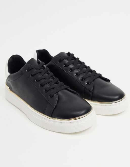 Black trainers with store gold trim