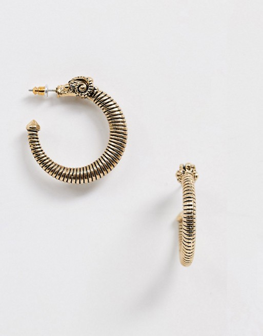 Sacred Hawk ram design hooped earrings in gold