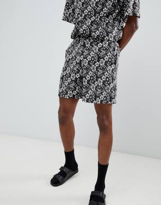 Sacred Hawk shorts in floral print-Black