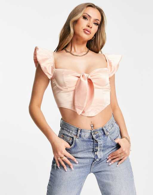 Saint Genies - Blushfarvet korset-croptop i satin med bindebånd foran og pufærmer 
