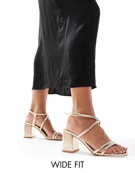 Sandalias doradas de tacón medio en bloque de SEQWL Wide Fit