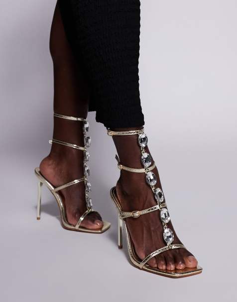 Sandalias doradas minimalistas de tacón con detalle de hebilla Leamy de SIMMI London - view 1