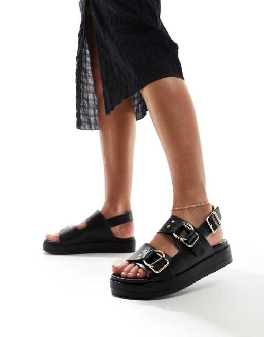 Sandalias negras con plataforma plana y hebilla de London Rebel