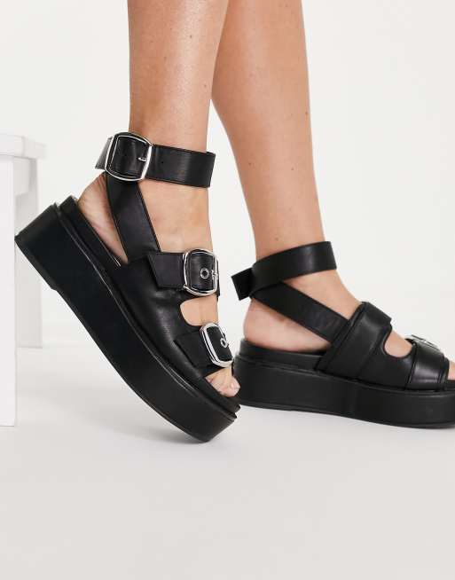 Sandalias negras plataforma online plana