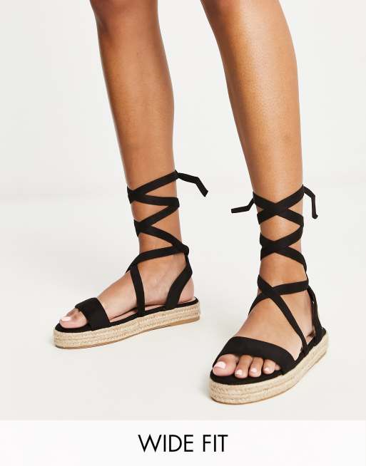 Sandalias negras de estilo alpargata con diseño anudado a la pierna de Truffle Collection Wide Fit