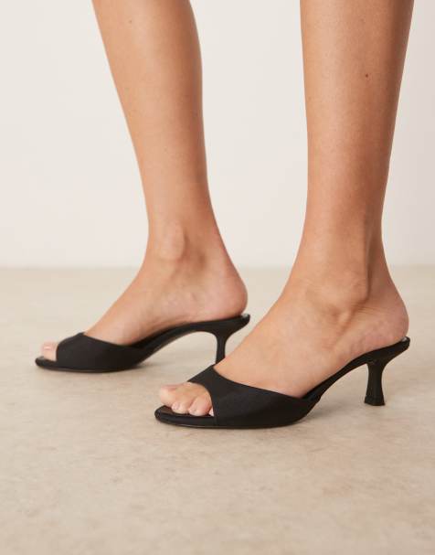 Sandalias negras de tacón con acabado satinado de Mango - view 1