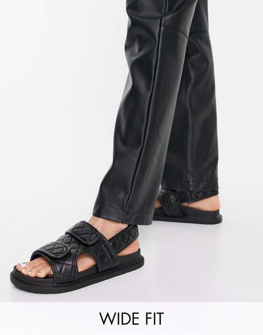 Sandalias negras planas con diseño guateado de dos tiras de Truffle Collection Wide Fit