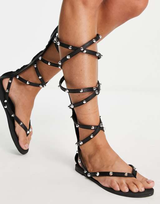 Sandalias negras planas de alta estilo romano con tachuelas Florida de ASOS DESIGN ASOS