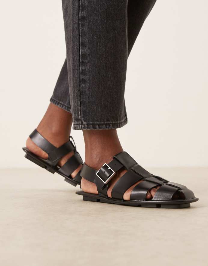 Calvin Klein Sandalias negras planas estilo cangrejeras de cuero de Jeans