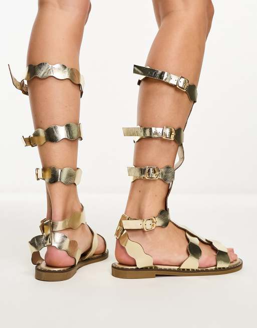 Sandalias romanas doradas hot sale