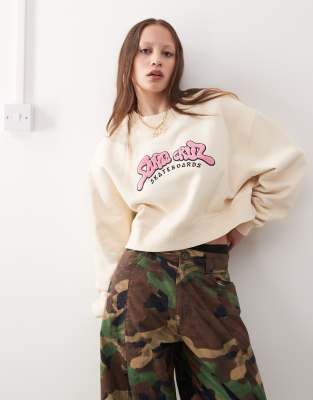 Santa Cruz Santa Cruz pink logo crewneck sweatshirt in cream-White
