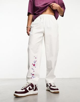 Santa Cruz unisex knibbs mind eye casual trousers in off white with placement embroidery