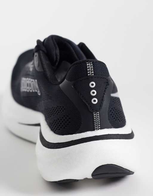 Saucony Ride 19 running trainers in black and white, 2 of 5