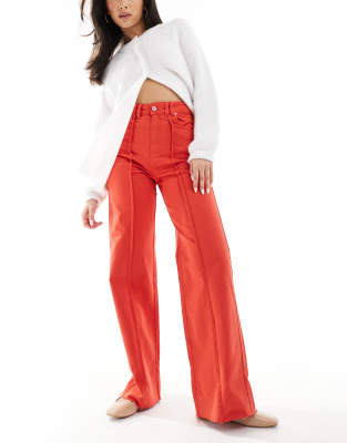 front color denim pants in orange