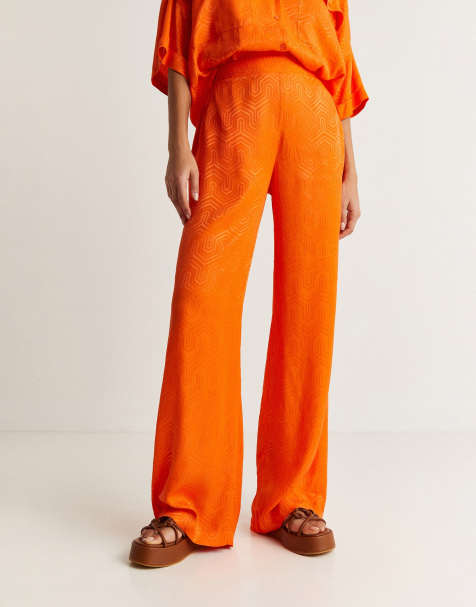 ASOS DESIGN relaxed wide leg flare trousers in orange