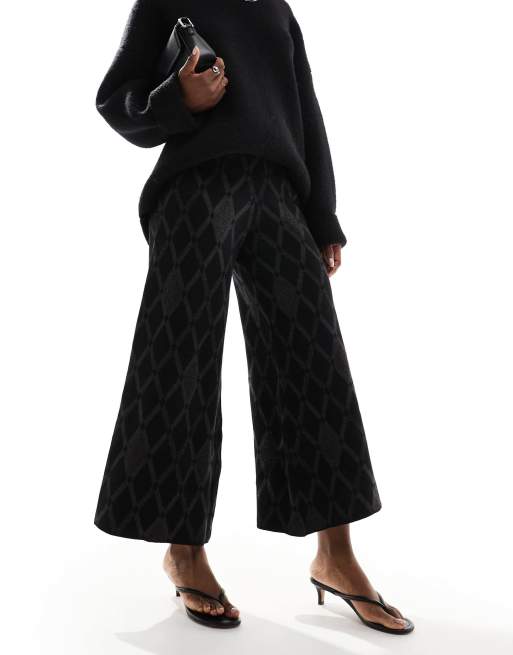 Scalpers - Pantaloni neri in maglia a rombi