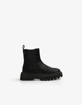 pony track boots in black