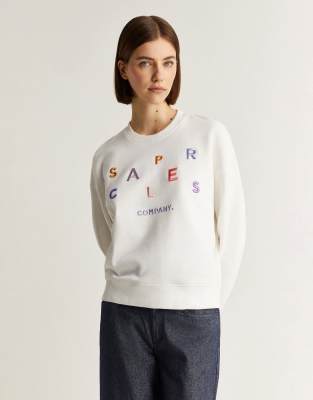 Scalpers - Pullover in Wollweiß mit bunter Buchstabenstickerei