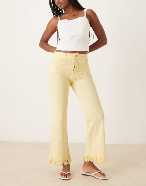 Scalpers Rivet color denim pants in light yellow