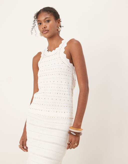 Scalpers - Top bianco in maglia con borchie