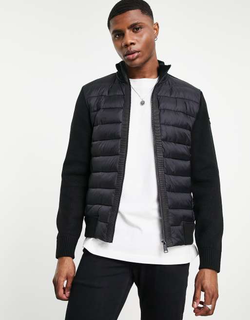 Down jacket with store knit sleeves