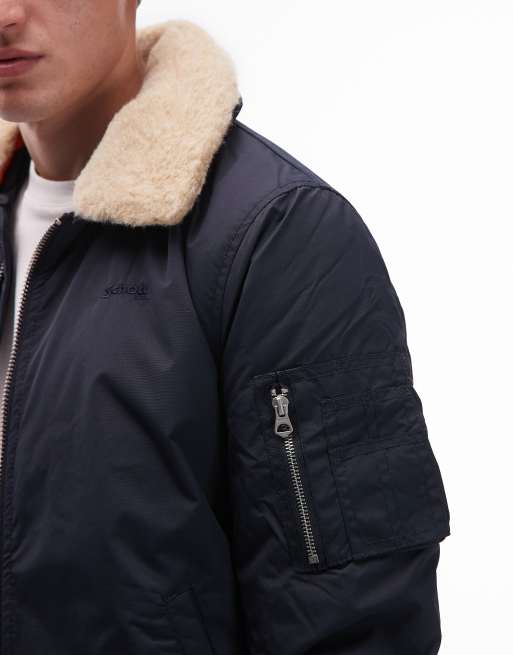 Schott - Giacca imbottita corta blu navy con colletto in pelliccia sintetica, tasca con zip e logo applicato, 5 di 5