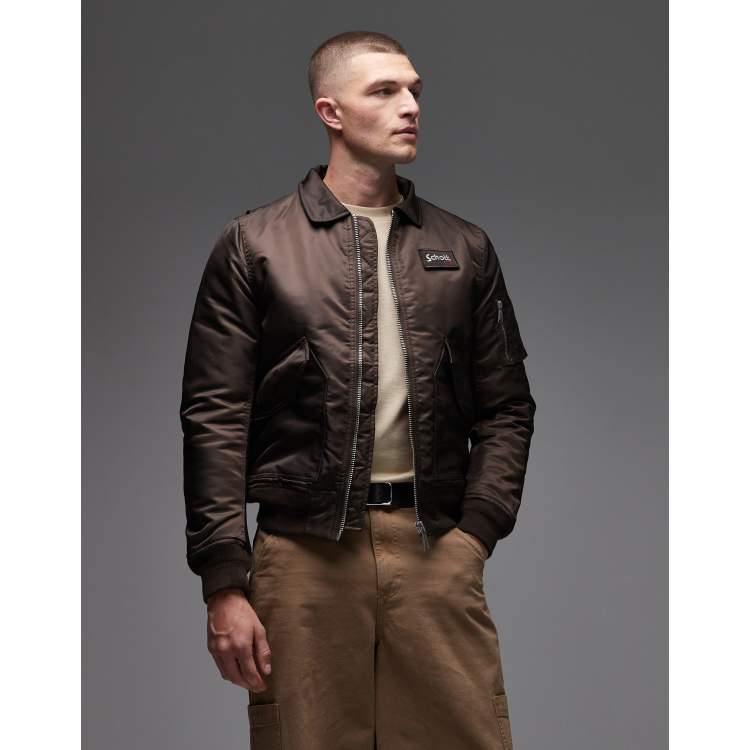 Schott logo patch detail zip pocket detail cropped padded jacket